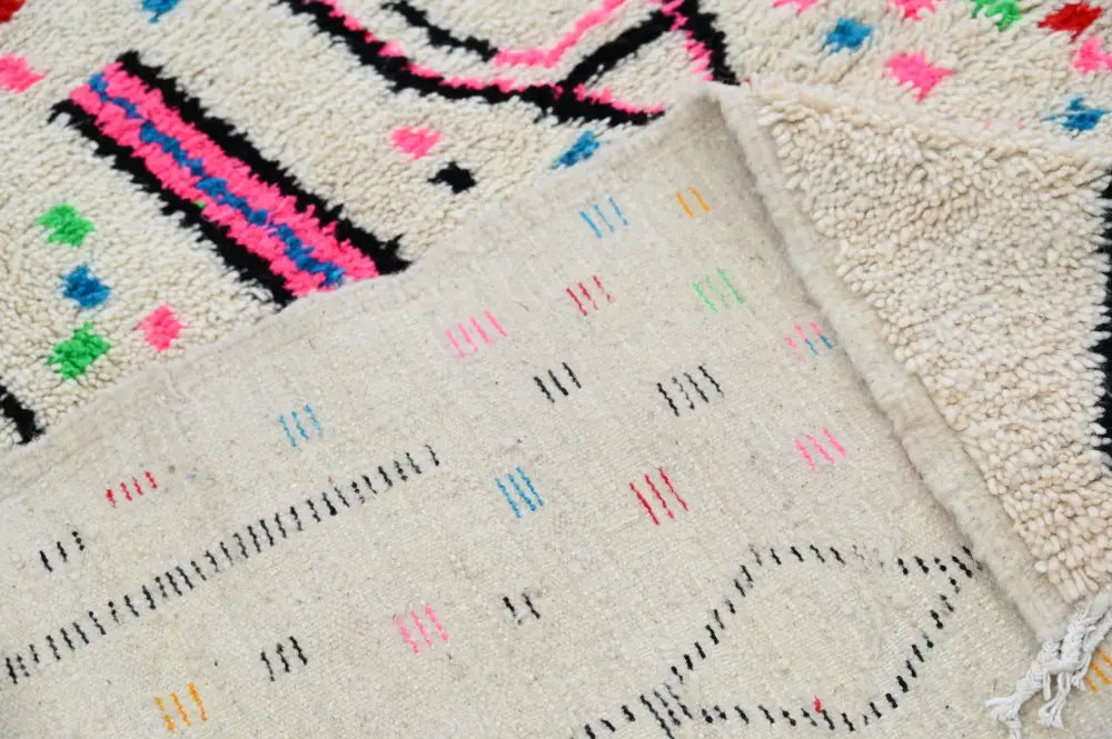 Beige DecorBites™ moroccan handmade traditional azilal rug with vibrant pink black and multicolored wool geometric patterns