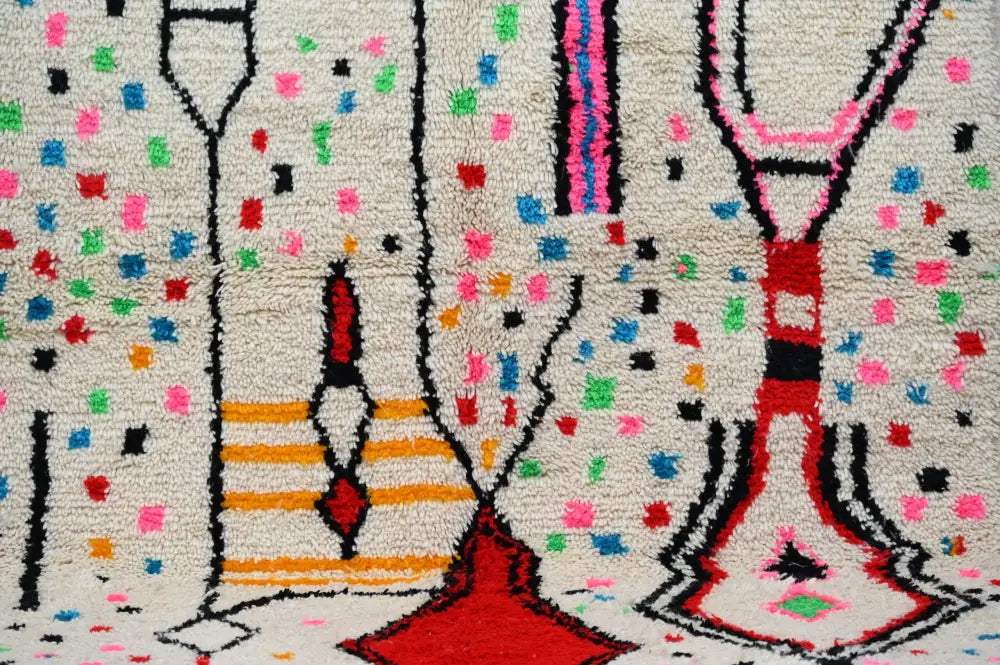 DecorBites™ moroccan handmade traditional azilal rug with bold geometric patterns in red black pink blue and green on cream