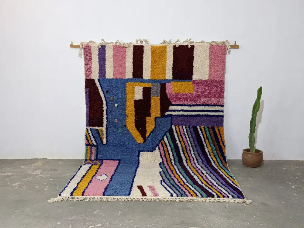Vibrant moroccan handmade traditional azilal rug with bold pink blue yellow purple and brown wool geometric patterns 304x210 cm