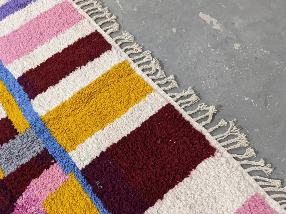 DecorBites™ moroccan handmade traditional azilal rug with bold pink maroon yellow blue stripes and cream fringe 304 x 210 cm