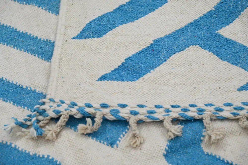 Blue and cream geometric patterned moroccan handmade traditional azilal rug with fringed edges 320 x 200 cm
