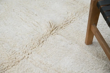 Cream-colored plush shaggy beni ouarain rug with a soft textured surface moroccan handmade traditional design
