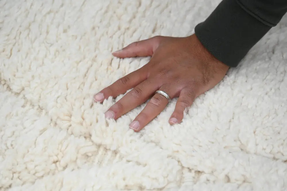 A soft off-white moroccan handmade beni ouarain rug with dense fluffy texture 300 x 208 cm by decorbites
