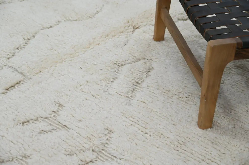 Cream-colored plush shag beni ouarain rug with subtle textured pattern moroccan handmade traditional design