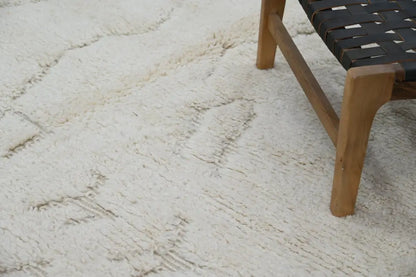 Cream-colored plush shag beni ouarain rug with subtle textured pattern moroccan handmade traditional design