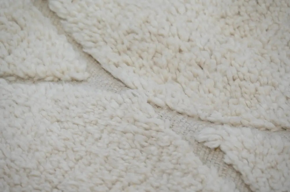 Cream-colored plush fleece fabric of moroccan handmade beni ouarain rug with soft textured surface 300 x 211 cm
