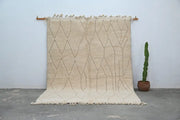 Beige moroccan handmade beni ouarain rug with geometric diamond pattern and fringed edges 300 x 211 cm