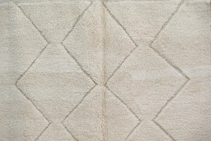 Beige moroccan handmade beni ouarain rug with plush textured surface and geometric diamond patterns 300 x 212 cm
