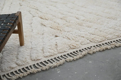 Cream-colored plush shaggy beni ouarain rug with textured surface and macrame fringe moroccan handmade 300 x 217 cm