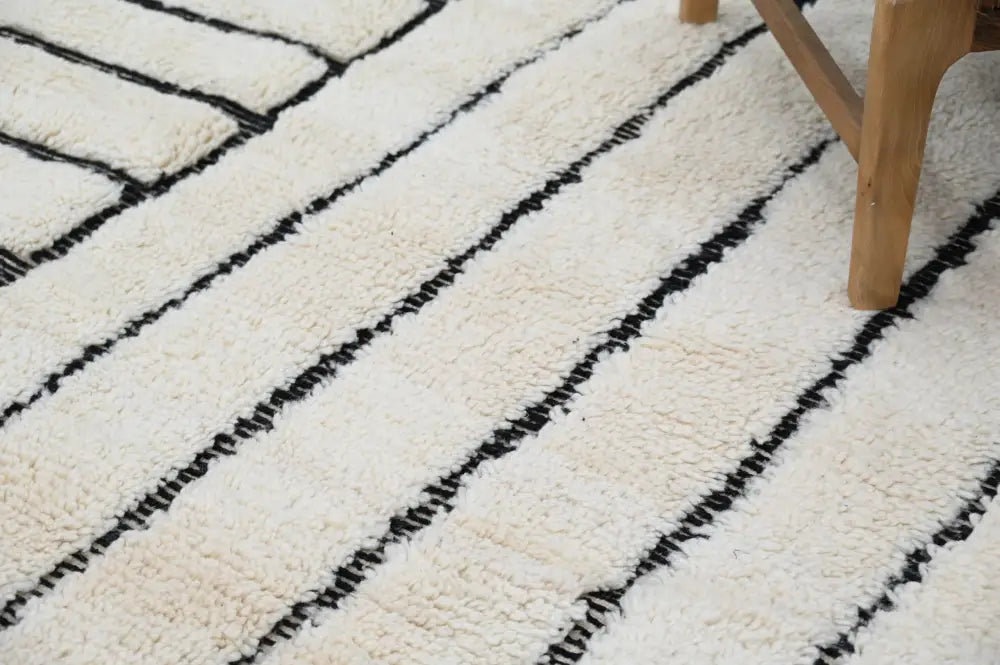 Cream-colored plush wool beni ouarain rug with bold black diagonal stripes moroccan handmade traditional design