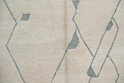 Beige wool beni ouarain rug with geometric gray and tan patterns moroccan handmade traditional beni ouarain rug