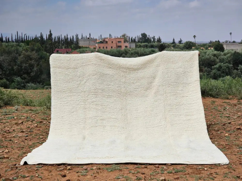 Cream-colored plush woolen beni ouarain rug with a textured fluffy surface moroccan handmade traditional design