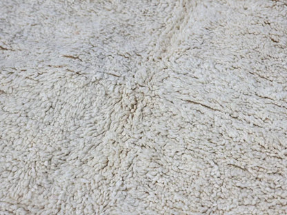 Cream-colored plush moroccan handmade beni ouarain rug with dense textured natural fiber weave 464 x 360 cm