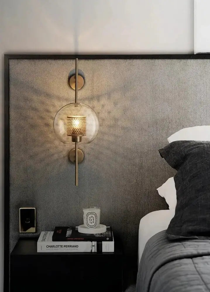 DecorBites™ Moroccan modern bathroom wall sconce with spherical glass globe and brass-finished metal accents