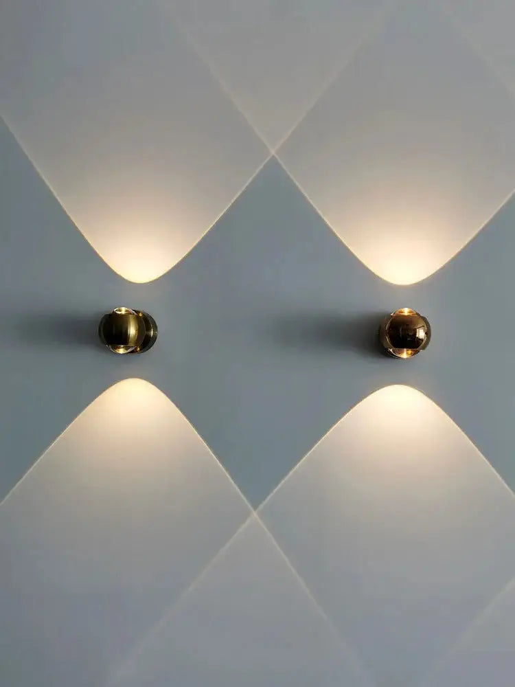 DecorBites™ Moroccan modern black brass led wall lamp with gold-toned spherical sconces and warm focused light beams
