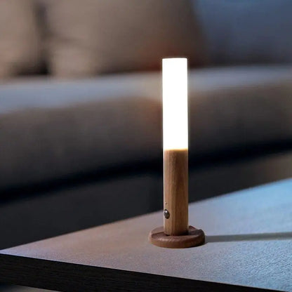 A sleek minimalist decorbites™ moroccan rechargeable battery-operated wall sconce with warm white led and wood base