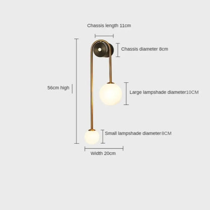 Modern brass-finished gold wall sconces with two spherical glass shades in traditional decorbites style