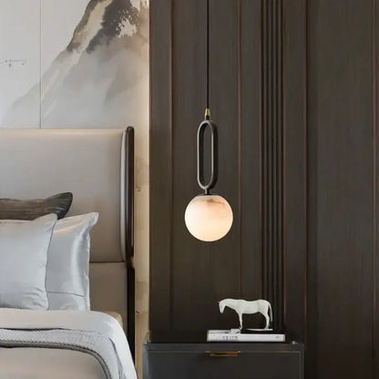 DecorBites™ Moroccan white marble pendant light with warm glowing spherical glass shade and elegant black metal frame with led bulb