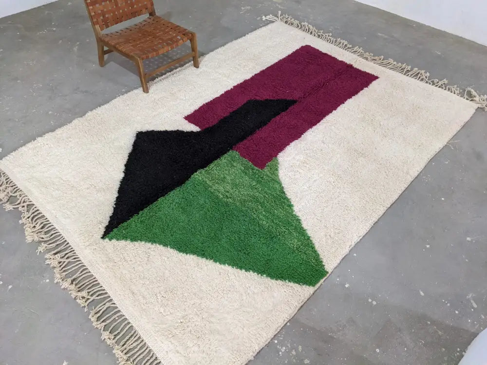 Cream-colored decorbites™ traditional azilal rug with bold black burgundy and green geometric shapes 298x220cm