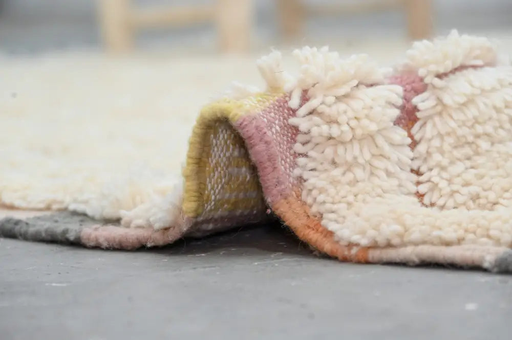 Decorbites™ moroccan traditional handmade azilal rug 240x147cm with a soft cream woolen surface and pink yellow stripes