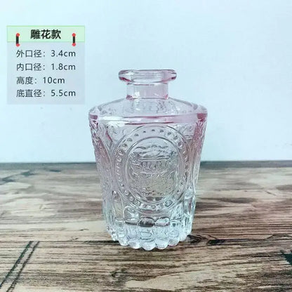 Decorbites™ glass vase with 2cm opening featuring clear floral embossed perfume bottle design and pink-tinted neck for flower pot use