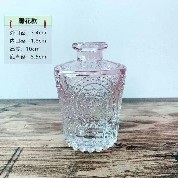 Decorbites™ glass vase with 2cm opening featuring clear floral embossed perfume bottle design and pink-tinted neck for flower pot use