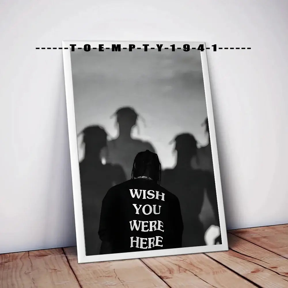 Black and white framed music album covers poster featuring a silhouette with wish you were here text on the back