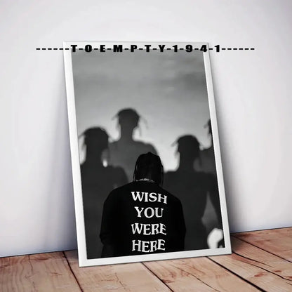 Black and white framed music album covers poster featuring a silhouette with wish you were here text on the back