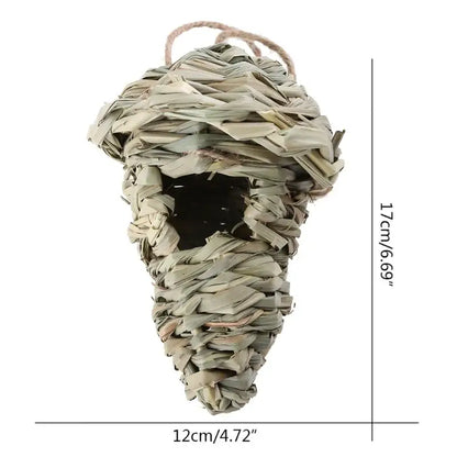 A woven light beige natural grass bird cage with a twine hanging loop in decorbites style birds nest design