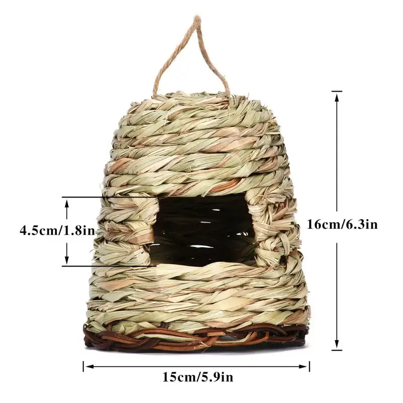 Handwoven natural grass bird cage with rustic textured exterior and dark interior for use as a parrot nest