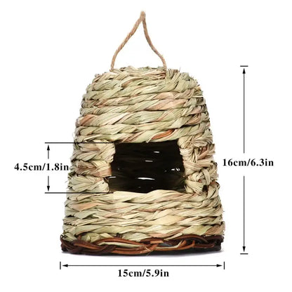 Handwoven natural grass bird cage with rustic textured exterior and dark interior for use as a parrot nest