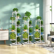 White natural iron plant stand with multiple tiers holding potted green plants in colorful pots DecorBites iron plant stand