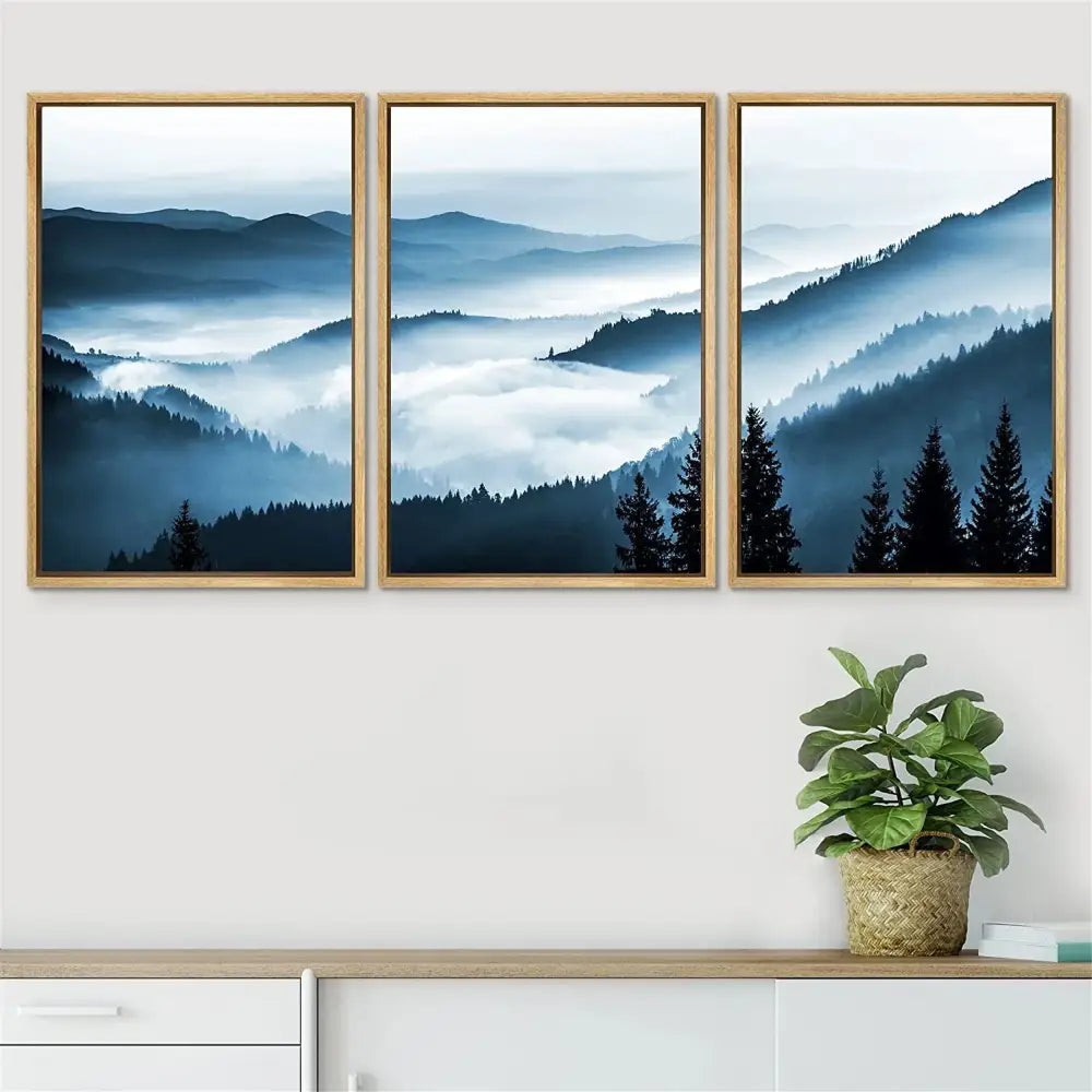 Set of three decorbites™ nature landscape canvas prints featuring misty blue tones in wooden frames for home decor