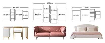 Pink upholstered sofa with matching throw pillows and slender metal legs beneath decorbites™ neutral canvas triptych wall art set