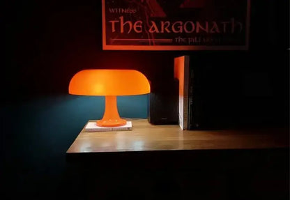 Orange led mushroom table lamp with smooth translucent plastic body for modern bedside and living room decoration