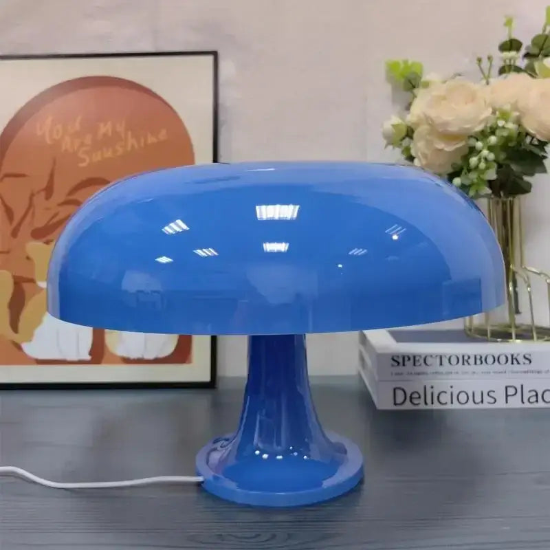 Vibrant blue led mushroom table lamp with glossy finish and smooth rounded contours for modern bedside lighting