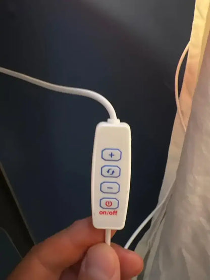 White rectangular remote control with blue buttons and red on/off label for DecorBites™ led mushroom table lamp
