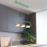 Modern mint green DecorBites™ 3-light hanging pendant with wooden shades and metal accents for kitchen island lighting