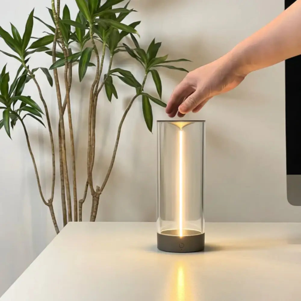 Decorbites™ nordic battery operated table lamp with sleek glass cylinder, warm golden light, and matte gray base