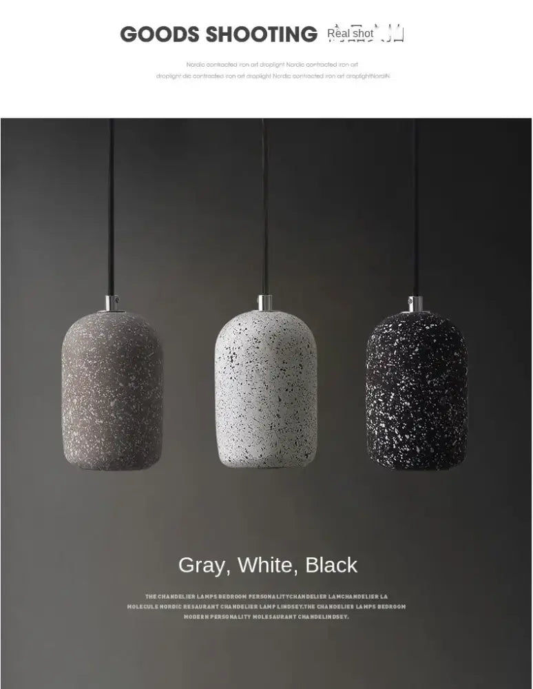 Three industrial style pendant lamps with speckled gray white and black cement textures from decorbites