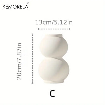 A sleek off-white nordic ceramic vase with a modern double-gourd shape and glossy finish from decorbites