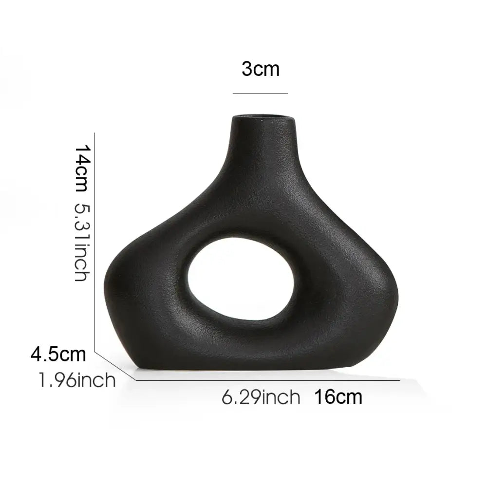Black matte nordic ceramic vase with oval cutout and smooth curves for vases home decor by DecorBites™