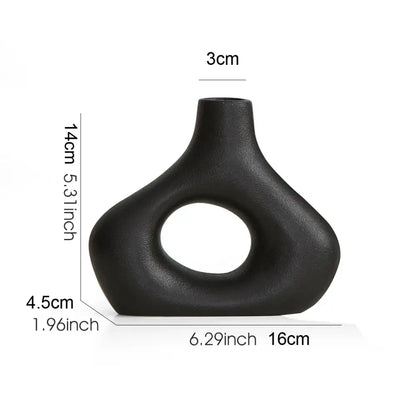 Black matte nordic ceramic vase with oval cutout and smooth curves for vases home decor by DecorBites™
