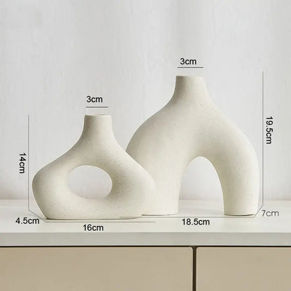 Cream-colored nordic ceramic vases home decor with organic sculptural forms and a matte finish by decorbites