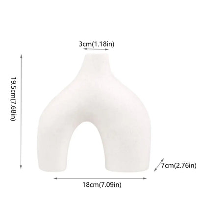 DecorBites™ nordic ceramic flower vase in white with a smooth matte finish and asymmetrical u-shaped design for home decor