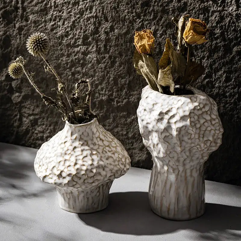 Two white textured nordic ceramic vases with organic shapes ideal for pampas grass decor in the decorbites collection