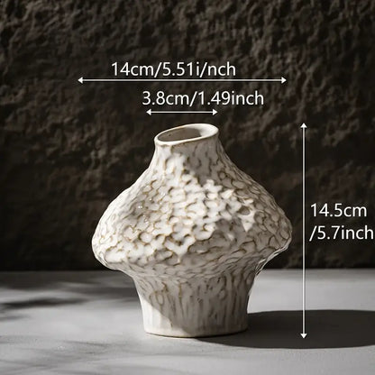 Decorbites™ nordic ceramic vase in white with a textured pebbled surface and organic asymmetrical shape with pampas grass