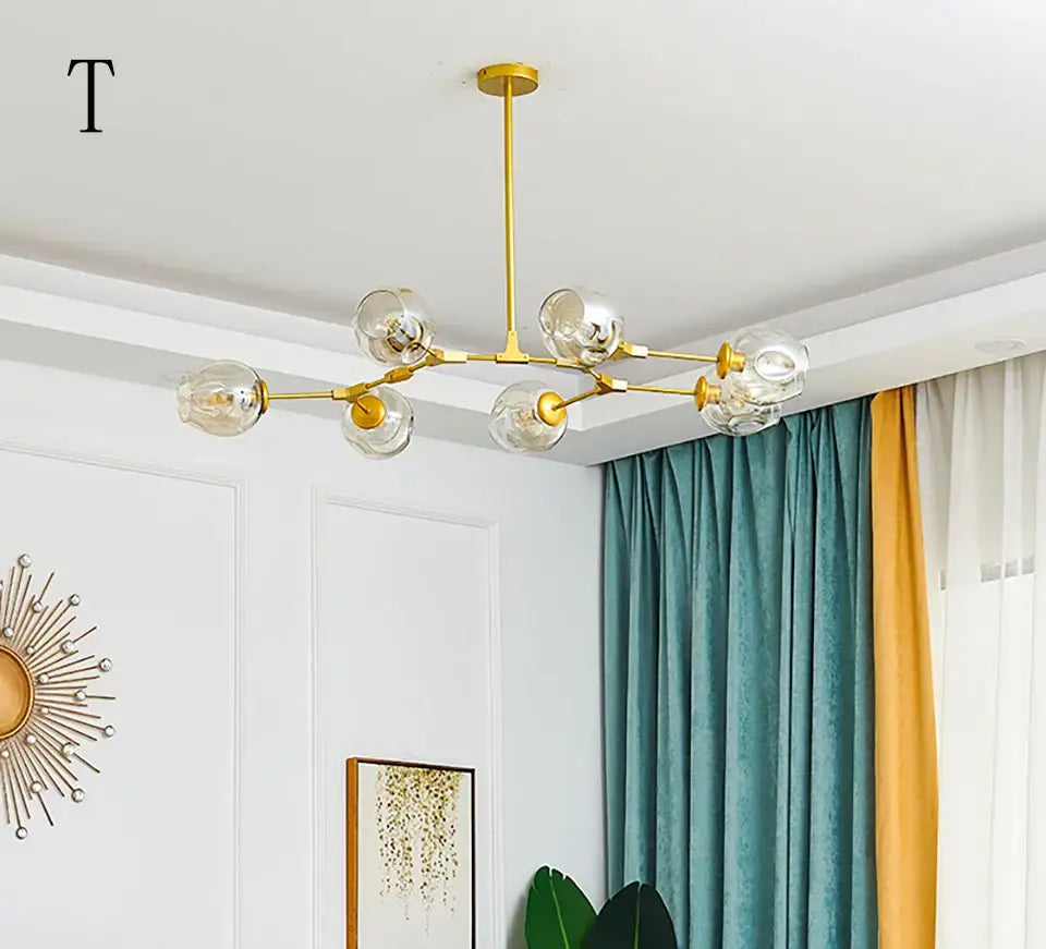 Gold-toned DecorBites™ nordic chandelier with clear glass globe bulbs hanging light fixture for living room use