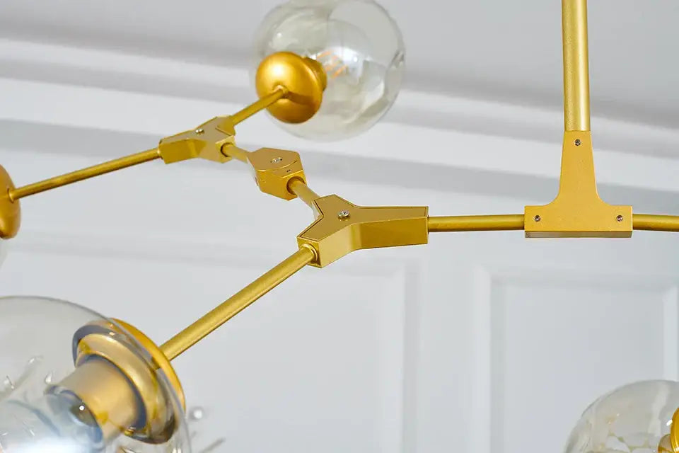 Gold-toned metal nordic chandelier with clear glass globe bulbs hanging light fixture for living room and dining room