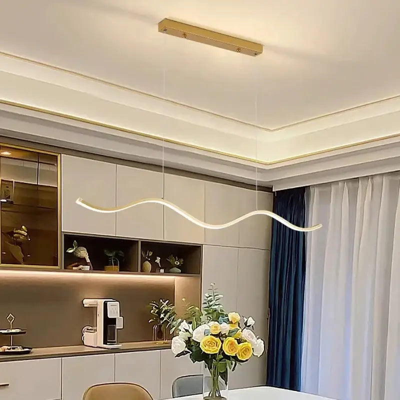 A sleek nordic chandelier pendant light fixture with smooth curves and warm white led illumination for dining room